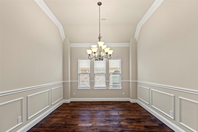 612 Buelwood Ct, Desoto, TX 75115 - unfurnished dining area featuring ornamental molding, a chandelier, dark wood finished floors, a decorative wall, and a wainscoted wall
