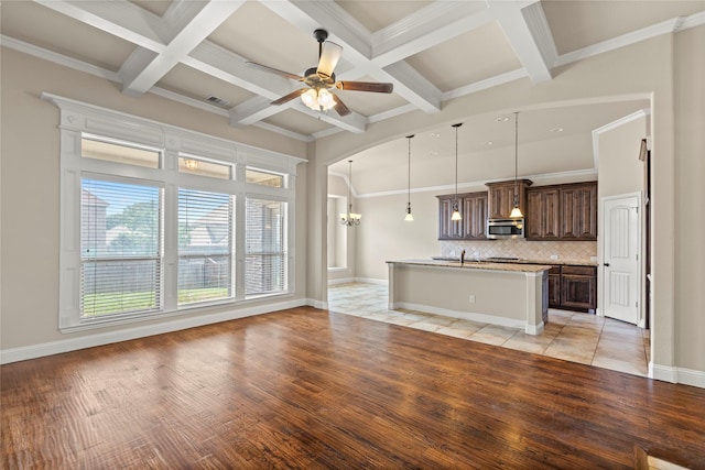 612 Buelwood Ct, Desoto, TX 75115 - unfurnished living room with coffered ceiling, light wood-type flooring, a ceiling fan, beam ceiling, and a chandelier