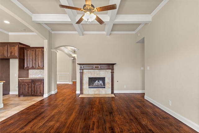 612 Buelwood Ct, Desoto, TX 75115 - unfurnished living room with ceiling fan, beam ceiling, arched walkways, ornate columns, and coffered ceiling