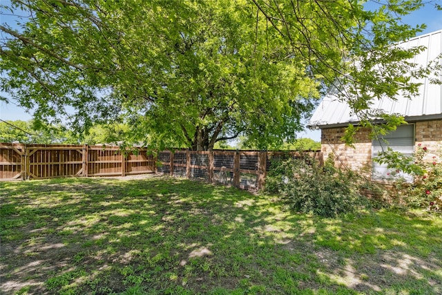 view of yard with a fenced backyard