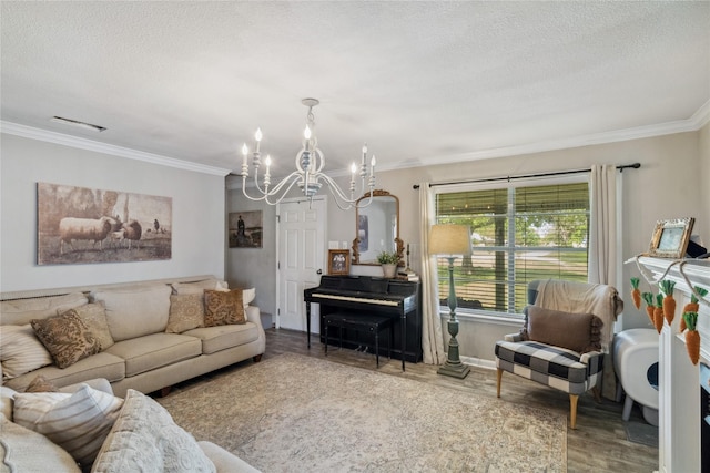 living area with baseboards, a chandelier, a textured ceiling, crown molding, and wood finished floors