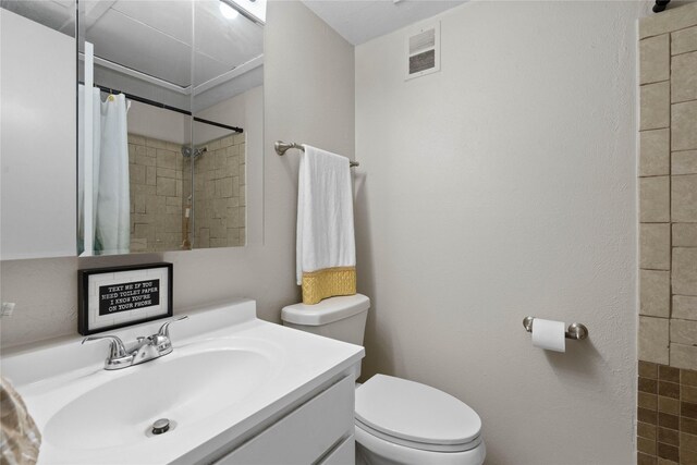 1905 W Morton St Unit 5, Denison, TX 75020 - carpeted bedroom with wallpapered walls, a crib, a closet, baseboards, and a ceiling fan