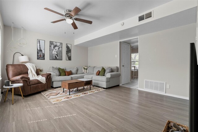 1905 W Morton St Unit 5, Denison, TX 75020 - living room featuring stairs, ceiling fan, light wood-type flooring, and baseboards