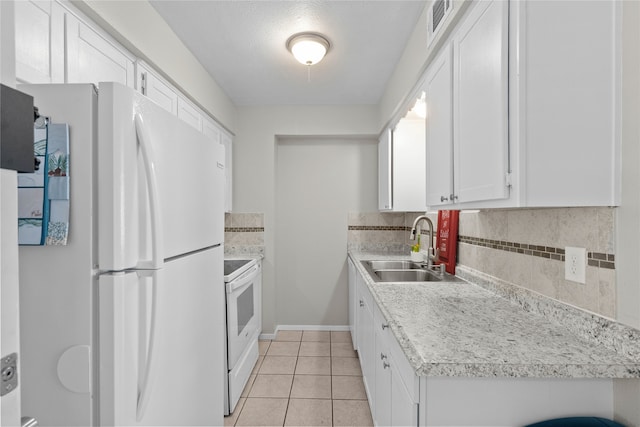 1905 W Morton St Unit 5, Denison, TX 75020 - kitchen featuring white appliances, a sink, backsplash, and white cabinets