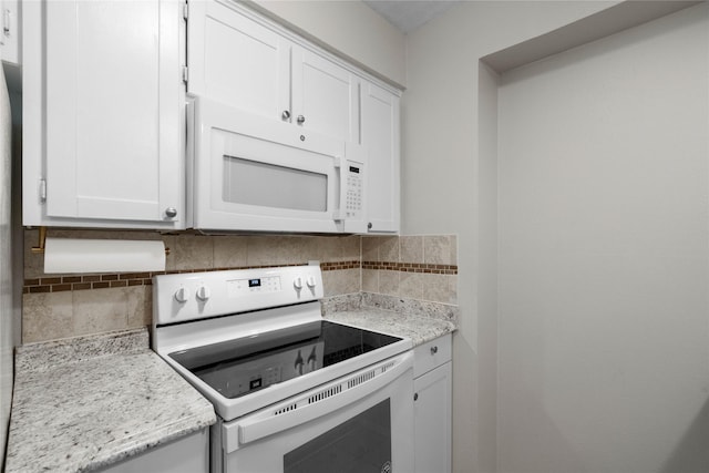 1905 W Morton St Unit 5, Denison, TX 75020 - kitchen with white appliances, decorative backsplash, white cabinetry, and light stone countertops