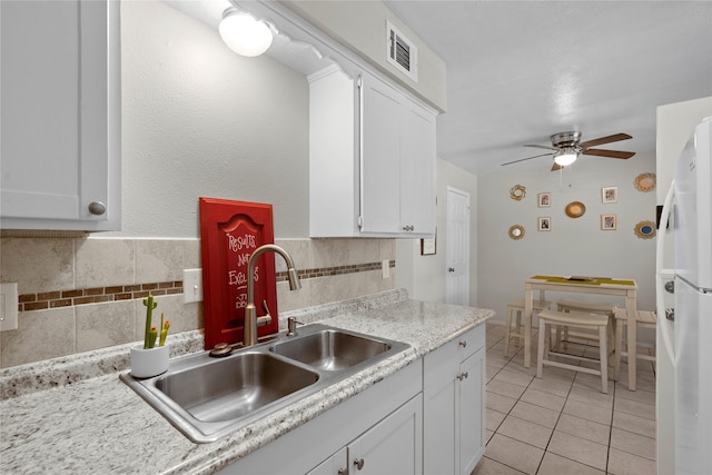 1905 W Morton St Unit 5, Denison, TX 75020 - kitchen featuring a sink, freestanding refrigerator, light tile patterned flooring, white cabinets, and ceiling fan