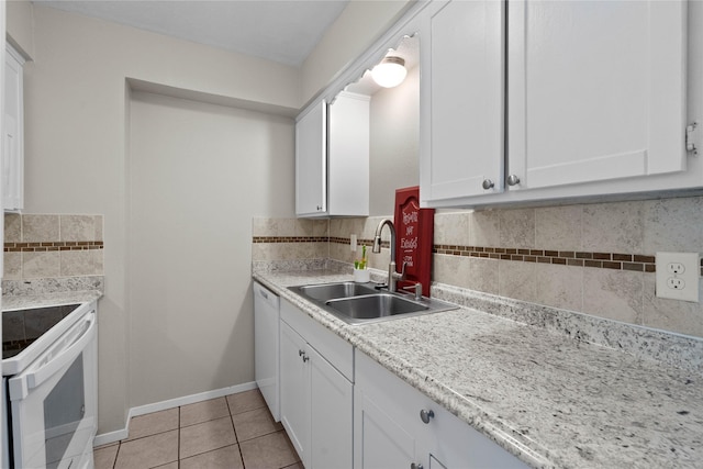 1905 W Morton St Unit 5, Denison, TX 75020 - kitchen featuring white appliances, a sink, light tile patterned floors, tasteful backsplash, and white cabinets