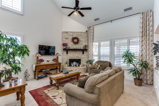 living room featuring ceiling fan, visible vents, high vaulted ceiling, and carpet flooring