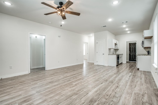 unfurnished living room featuring baseboards, light wood-style flooring, recessed lighting, and a ceiling fan
