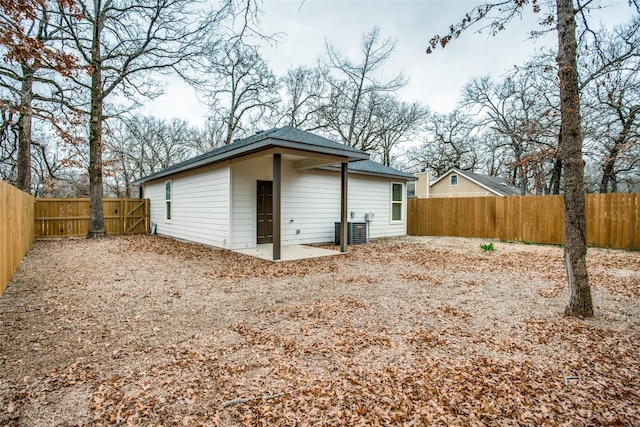 garage with central air condition unit and fence