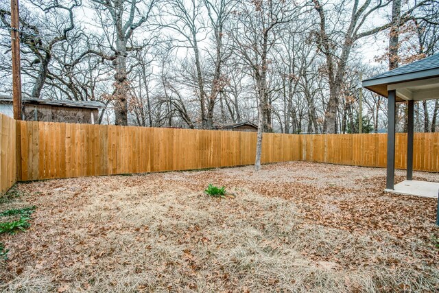 view of yard with a fenced backyard