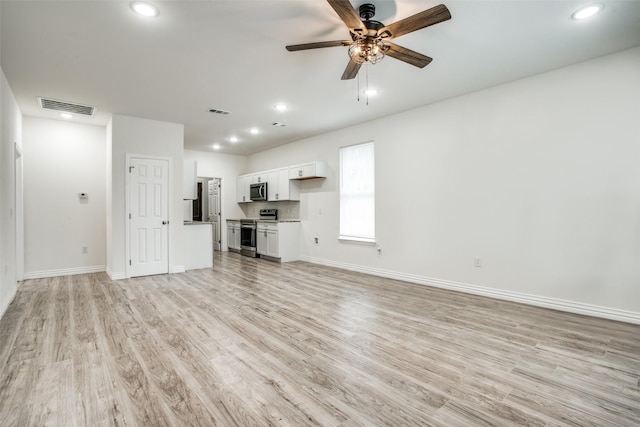 unfurnished living room with visible vents, light wood finished floors, baseboards, ceiling fan, and recessed lighting