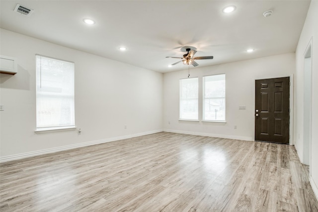 unfurnished living room with light wood finished floors, baseboards, visible vents, ceiling fan, and recessed lighting