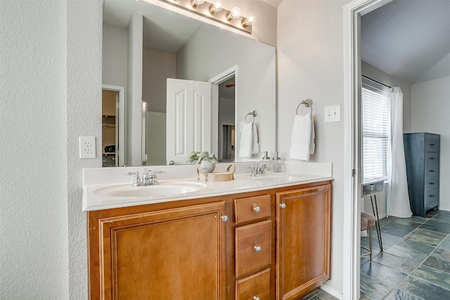 bathroom with double vanity and a sink