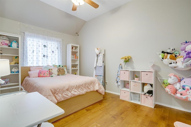 bedroom featuring wood-type flooring, baseboards, lofted ceiling, and ceiling fan