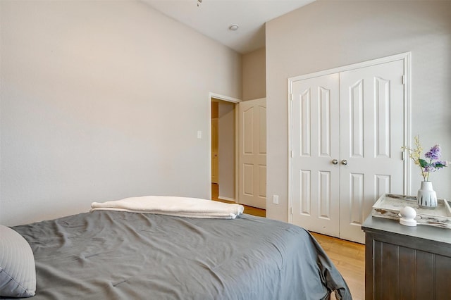 bedroom with a closet and light wood-type flooring