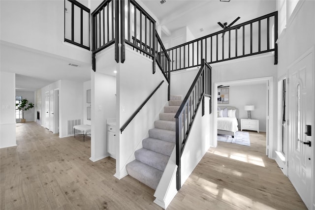 7724 Standish Cir, Plano, TX 75025 - staircase featuring a high ceiling and wood finished floors