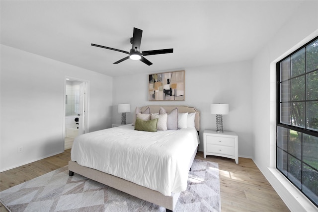 7724 Standish Cir, Plano, TX 75025 - bedroom with wood finished floors, ensuite bathroom, and ceiling fan
