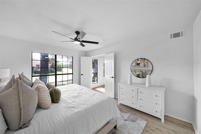 7724 Standish Cir, Plano, TX 75025 - bedroom with light wood-style floors, ceiling fan, and access to exterior