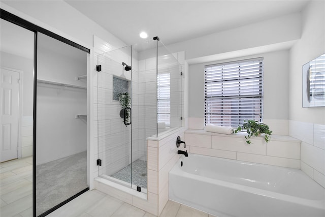7724 Standish Cir, Plano, TX 75025 - full bathroom with a garden tub, a stall shower, a spacious closet, tile patterned flooring, and recessed lighting
