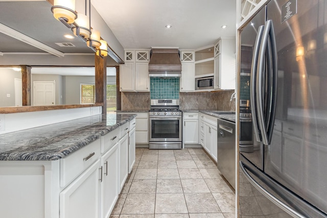 2306 Ravenwood Dr, Grand Prairie, TX 75050 - kitchen with appliances with stainless steel finishes, premium range hood, open shelves, backsplash, and white cabinets