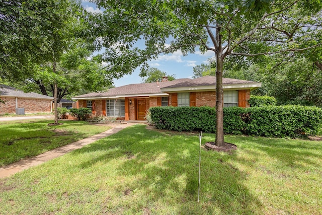 2306 Ravenwood Dr, Grand Prairie, TX 75050 - ranch-style home featuring a front yard, a chimney, and brick siding