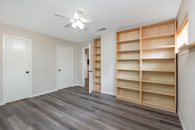 2306 Ravenwood Dr, Grand Prairie, TX 75050 - unfurnished bedroom featuring dark wood finished floors, baseboards, and a ceiling fan