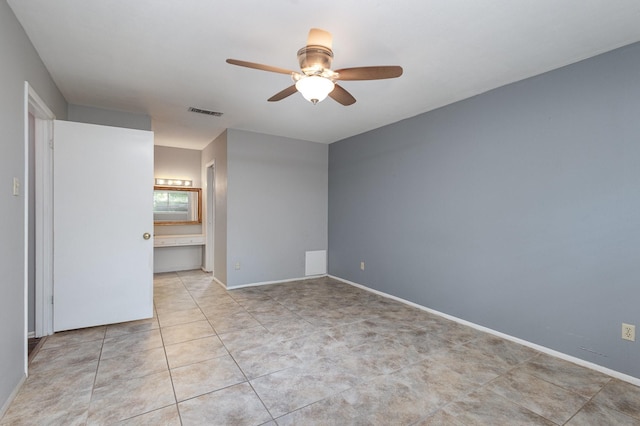 2306 Ravenwood Dr, Grand Prairie, TX 75050 - unfurnished room with ceiling fan, tile patterned floors, and baseboards