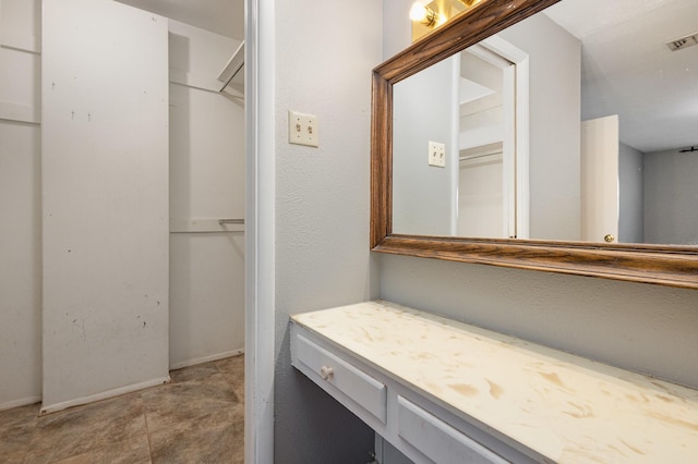 2306 Ravenwood Dr, Grand Prairie, TX 75050 - bathroom with vanity and baseboards
