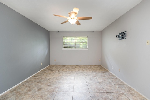 2306 Ravenwood Dr, Grand Prairie, TX 75050 - unfurnished room with a ceiling fan and light tile patterned floors