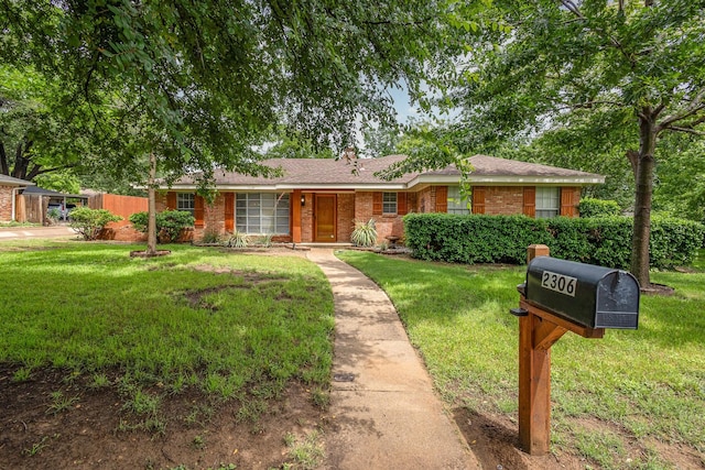 2306 Ravenwood Dr, Grand Prairie, TX 75050 - ranch-style house with a front lawn and brick siding