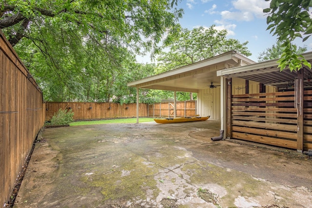 2306 Ravenwood Dr, Grand Prairie, TX 75050 - view of patio featuring a ceiling fan and a fenced backyard