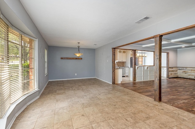 2306 Ravenwood Dr, Grand Prairie, TX 75050 - empty room featuring a chandelier