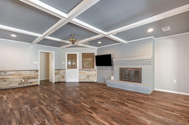 2306 Ravenwood Dr, Grand Prairie, TX 75050 - unfurnished living room featuring coffered ceiling, wood finished floors, a ceiling fan, beamed ceiling, and a brick fireplace