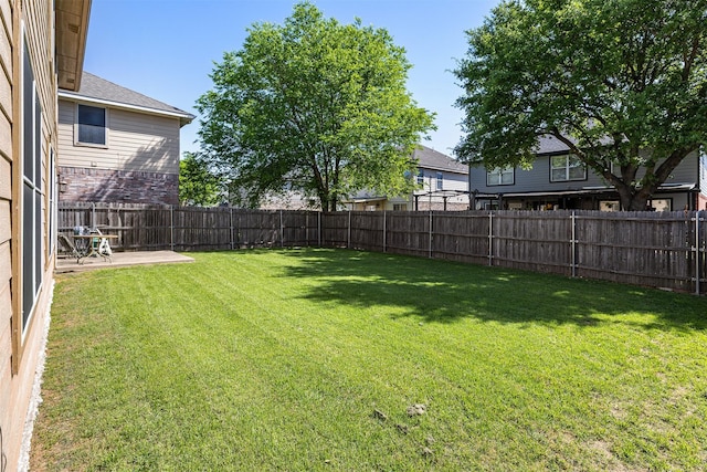 view of yard featuring a fenced backyard and a patio