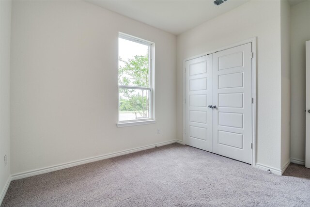 3800 Parsons St, Crandall, TX 75114 - unfurnished bedroom with baseboards, carpet flooring, and multiple windows