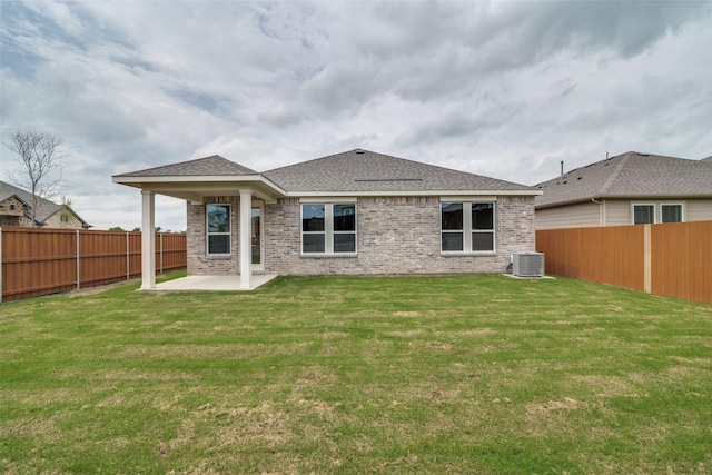 3800 Parsons St, Crandall, TX 75114 - back of house with a fenced backyard, a yard, a patio area, and brick siding