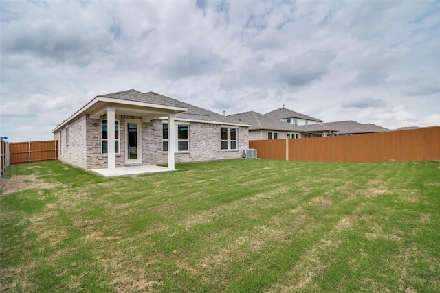 3800 Parsons St, Crandall, TX 75114 - rear view of house featuring a patio, a fenced backyard, brick siding, central air condition unit, and a yard