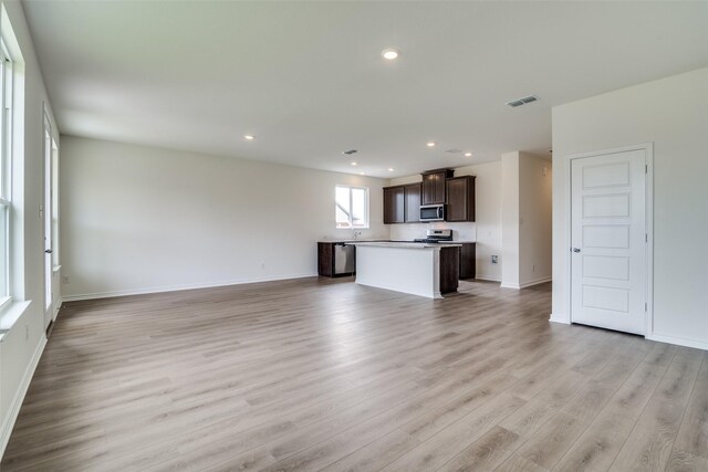 3800 Parsons St, Crandall, TX 75114 - unfurnished living room with recessed lighting, baseboards, visible vents, and light wood-type flooring