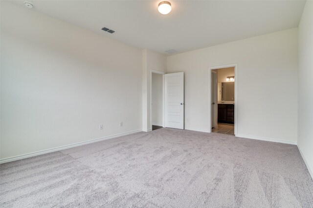 3800 Parsons St, Crandall, TX 75114 - unfurnished bedroom featuring baseboards, ensuite bathroom, carpet, and visible vents