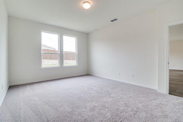 3800 Parsons St, Crandall, TX 75114 - carpeted spare room with baseboards and visible vents