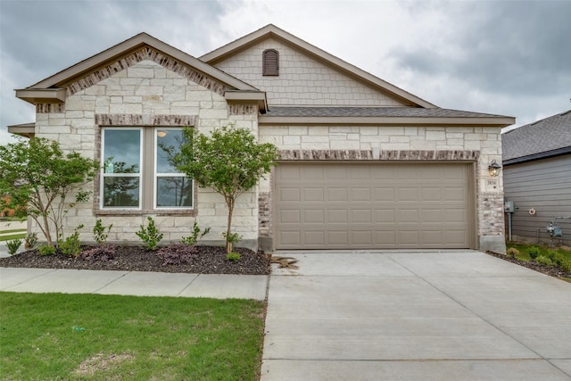 3836 Parsons St, Crandall, TX 75114 - view of front of property featuring concrete driveway, an attached garage, and stone siding