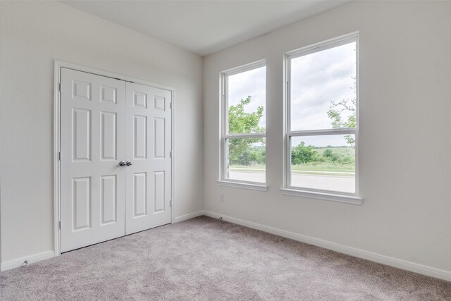 3836 Parsons St, Crandall, TX 75114 - unfurnished bedroom with baseboards, carpet, and a closet