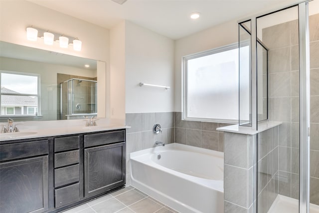3808 Parsons St, Crandall, TX 75114 - bathroom with tile patterned flooring, double vanity, a bath, a shower stall, and a sink