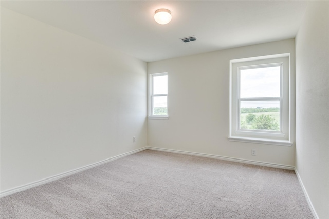 3808 Parsons St, Crandall, TX 75114 - unfurnished room with baseboards, light colored carpet, and visible vents