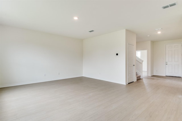 3808 Parsons St, Crandall, TX 75114 - unfurnished room with stairs, recessed lighting, baseboards, light wood-type flooring, and visible vents