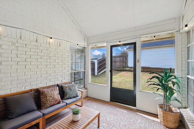 sunroom with plenty of natural light and an outdoor hangout area