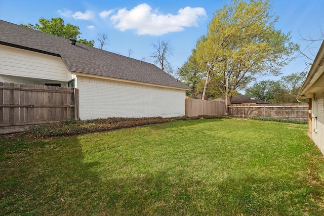 view of yard featuring a fenced backyard