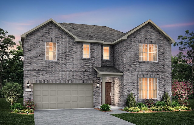 view of front of house featuring driveway, an attached garage, and brick siding