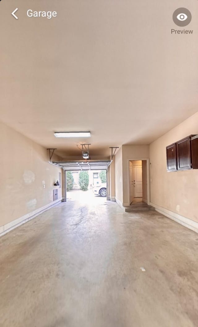 736 Skyline Bluff Ct, Fort Worth, TX 76102 - garage featuring baseboards and a garage door opener
